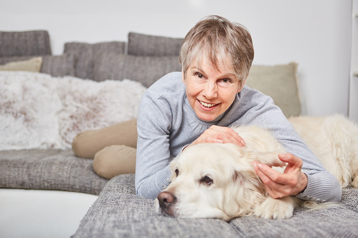 older woman and golden retriever