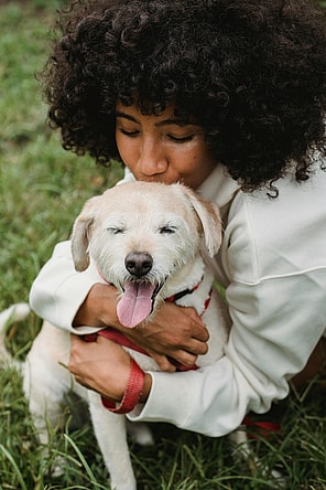 Woman cuddling her dog