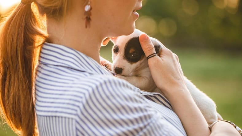 Woman with adopted puppy dog