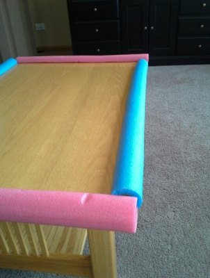 use pool noodles to make hard edges softer so your blind dog can safely navigate around