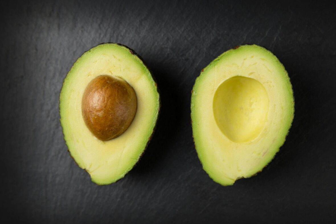 Close-up of a sliced avocado with the edible sides facing up. Avocados are among the human foods toxic to dogs 